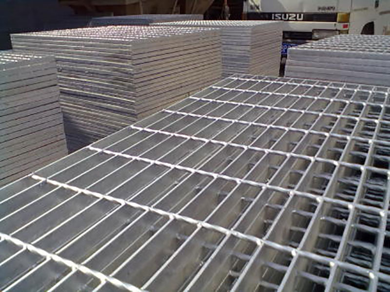 many forge welded metal grating panels stored on top of each other
