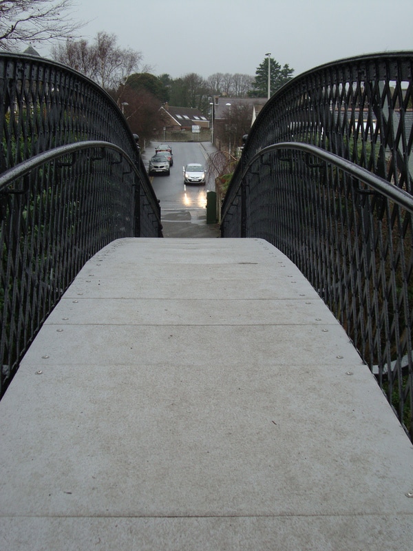 grey pultruded plank used as decking for a pedestrian bridge